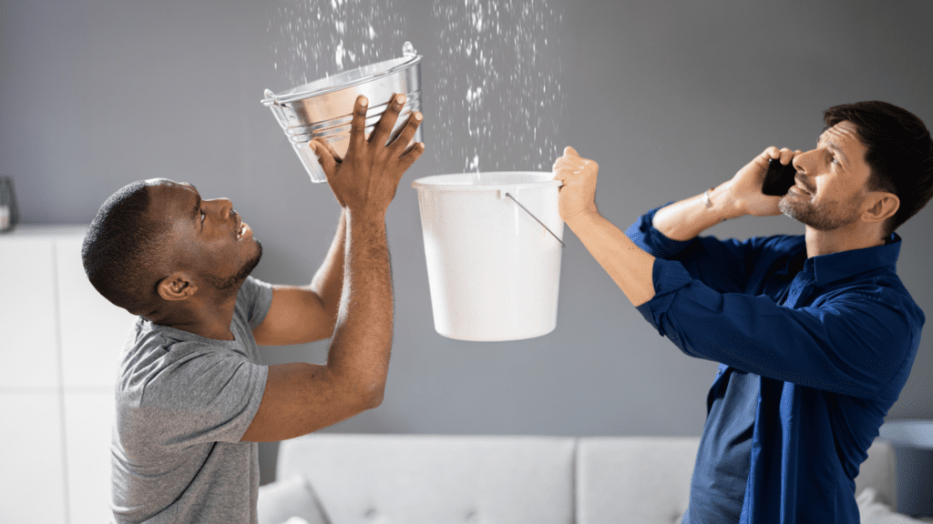 Men catching water in buckets