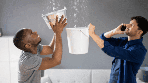 Men catching water in buckets